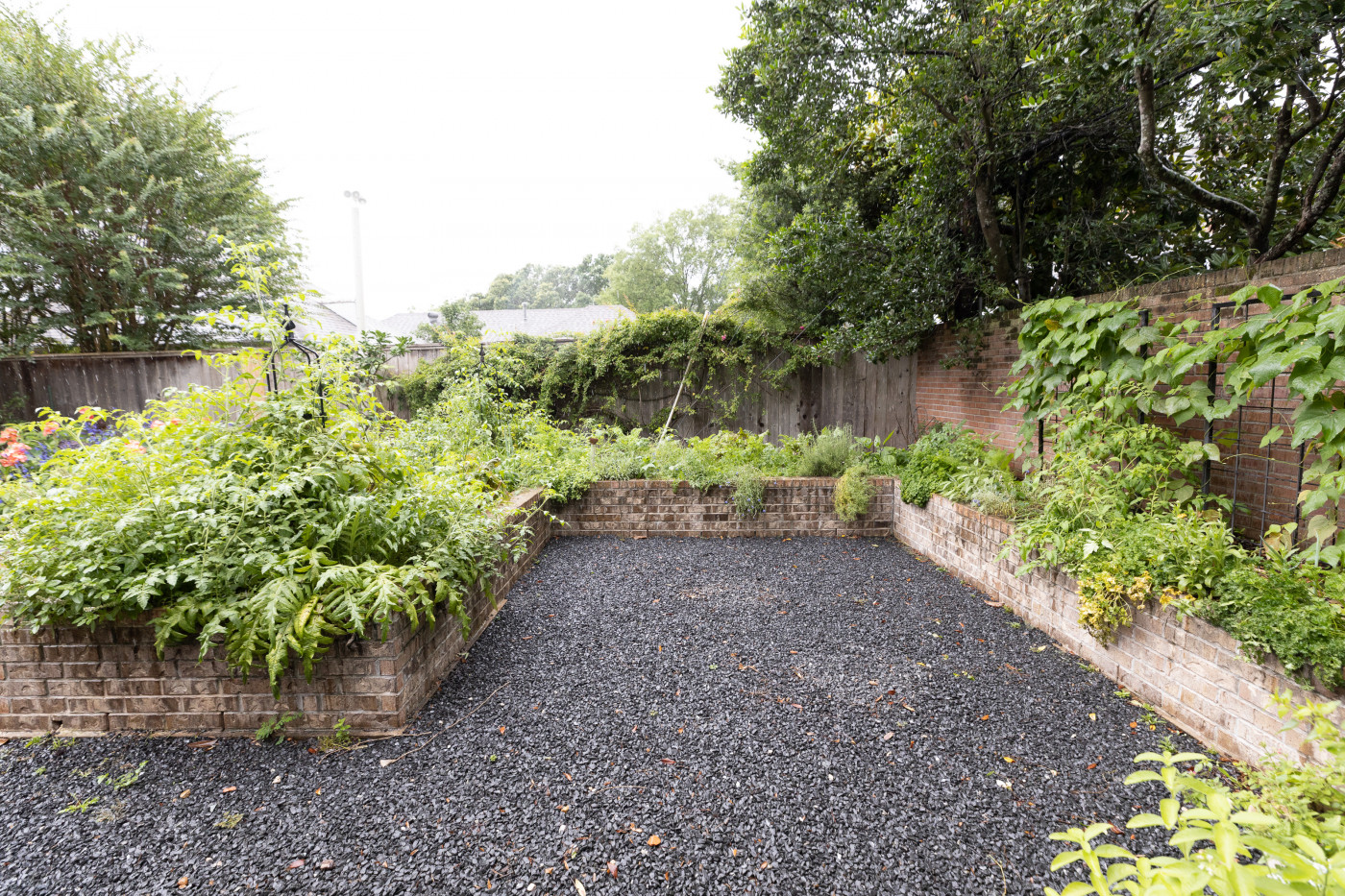large keyhole garden with brick raised beds