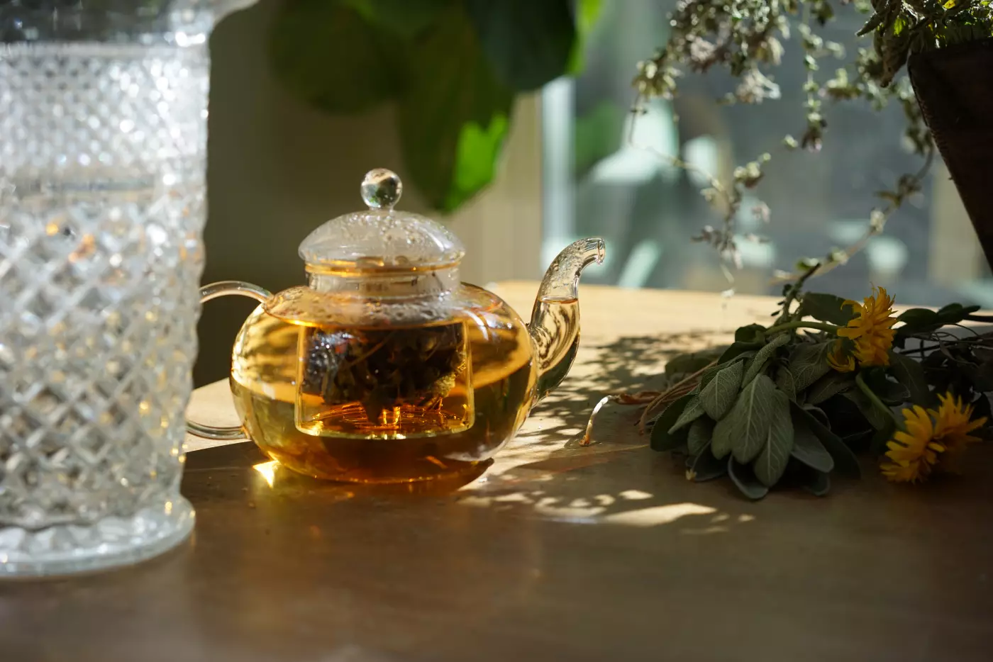 a glass tea pot with herbal tea