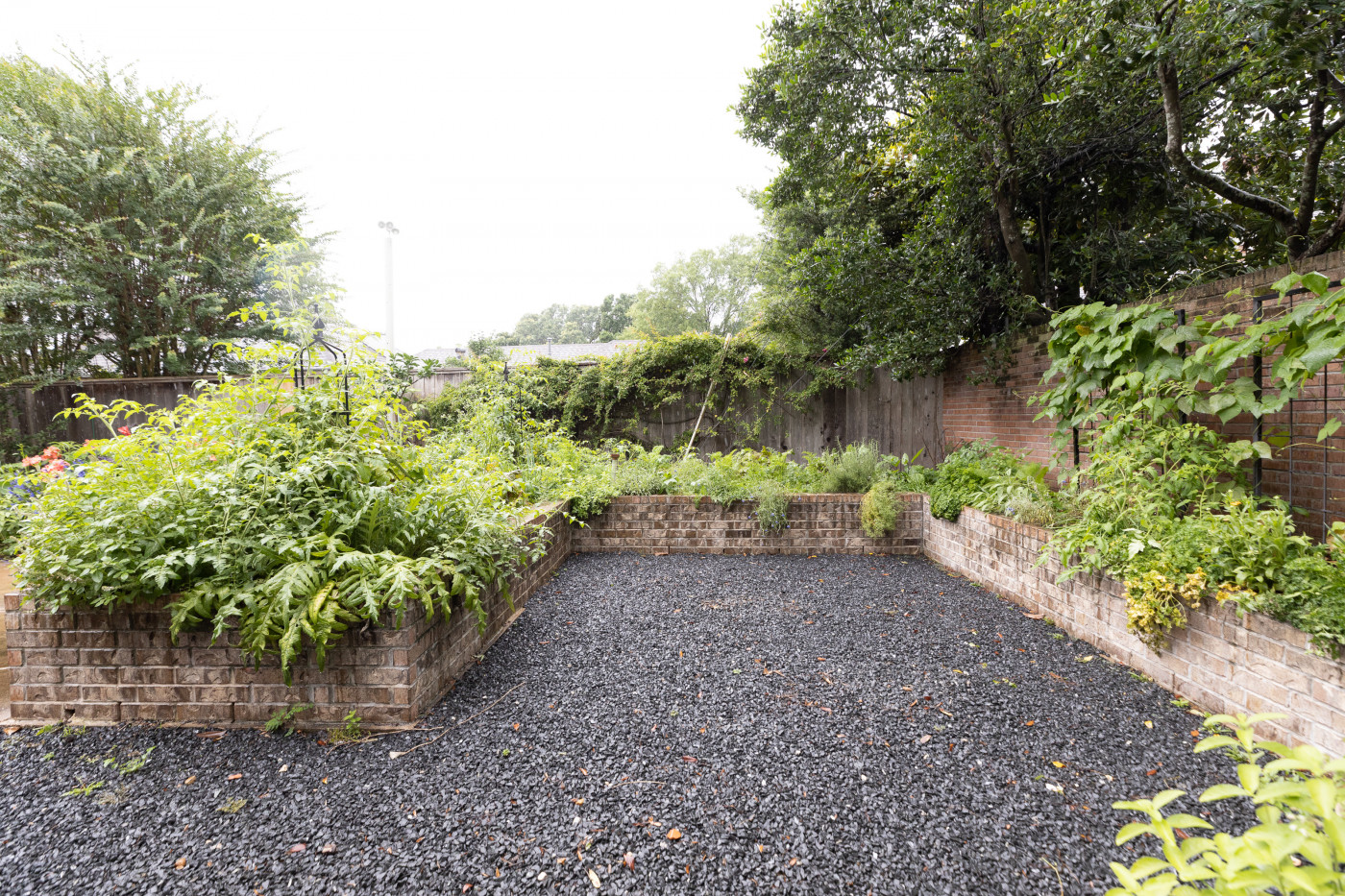 keyhole garden with brick raised beds