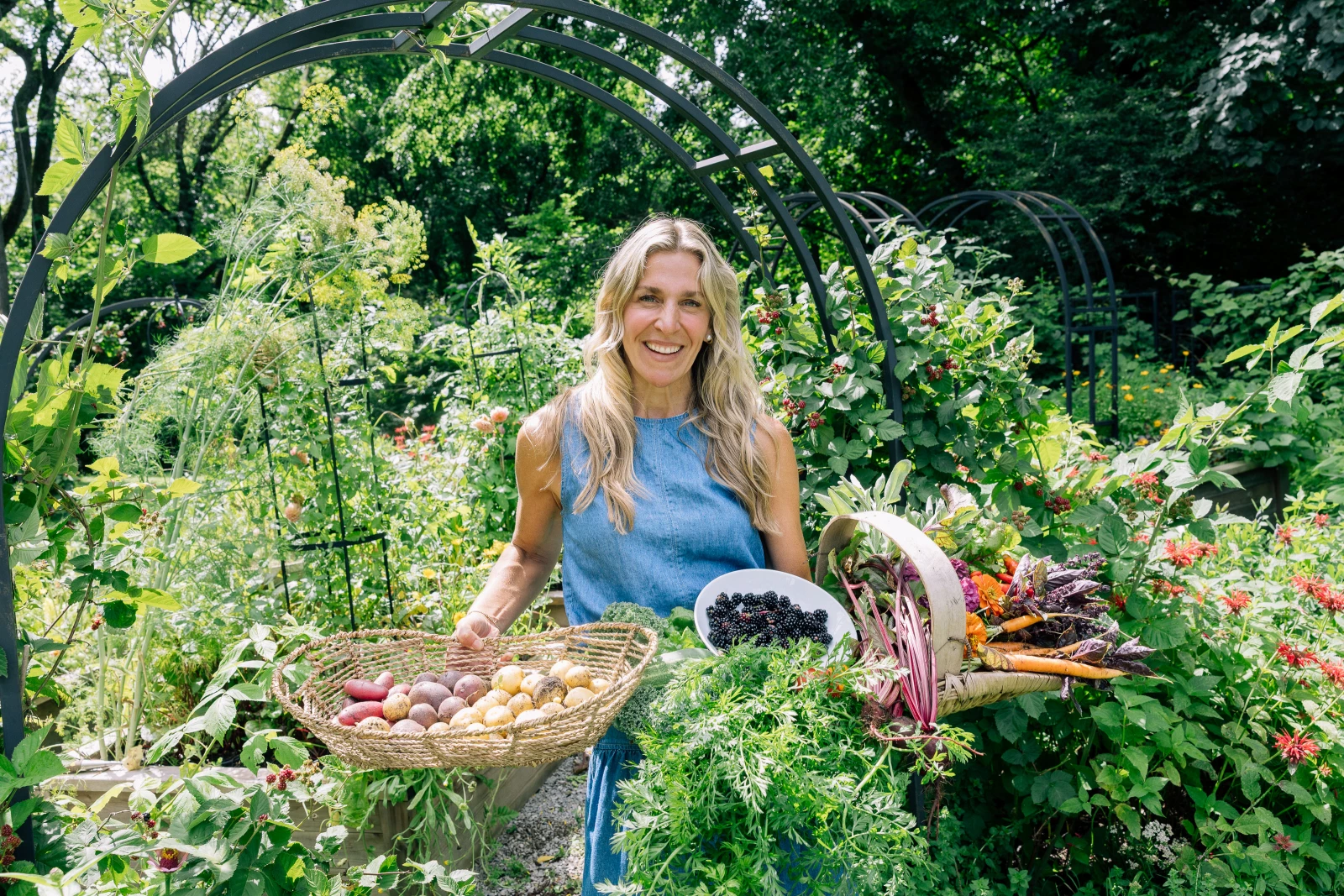 Nicole with harvest baskets