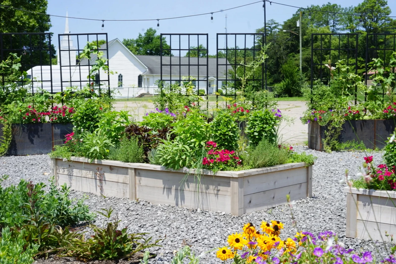 A raised bed with Nicole Panel Trellises