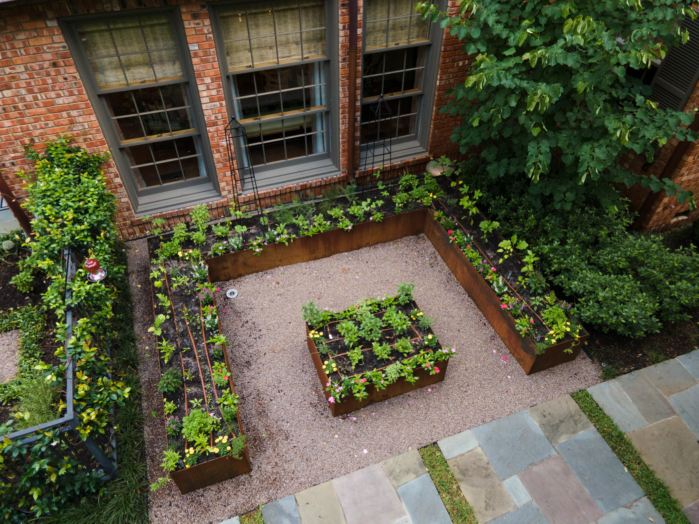 keyhole garden with corten steel raised beds