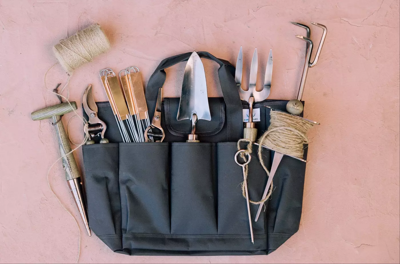 Photo of a gardening bag with garden tools inside